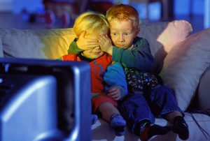 Scared Little Boys Watching TV --- Image by © G. Baden/Corbis